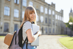 Student posing for a picture on campus